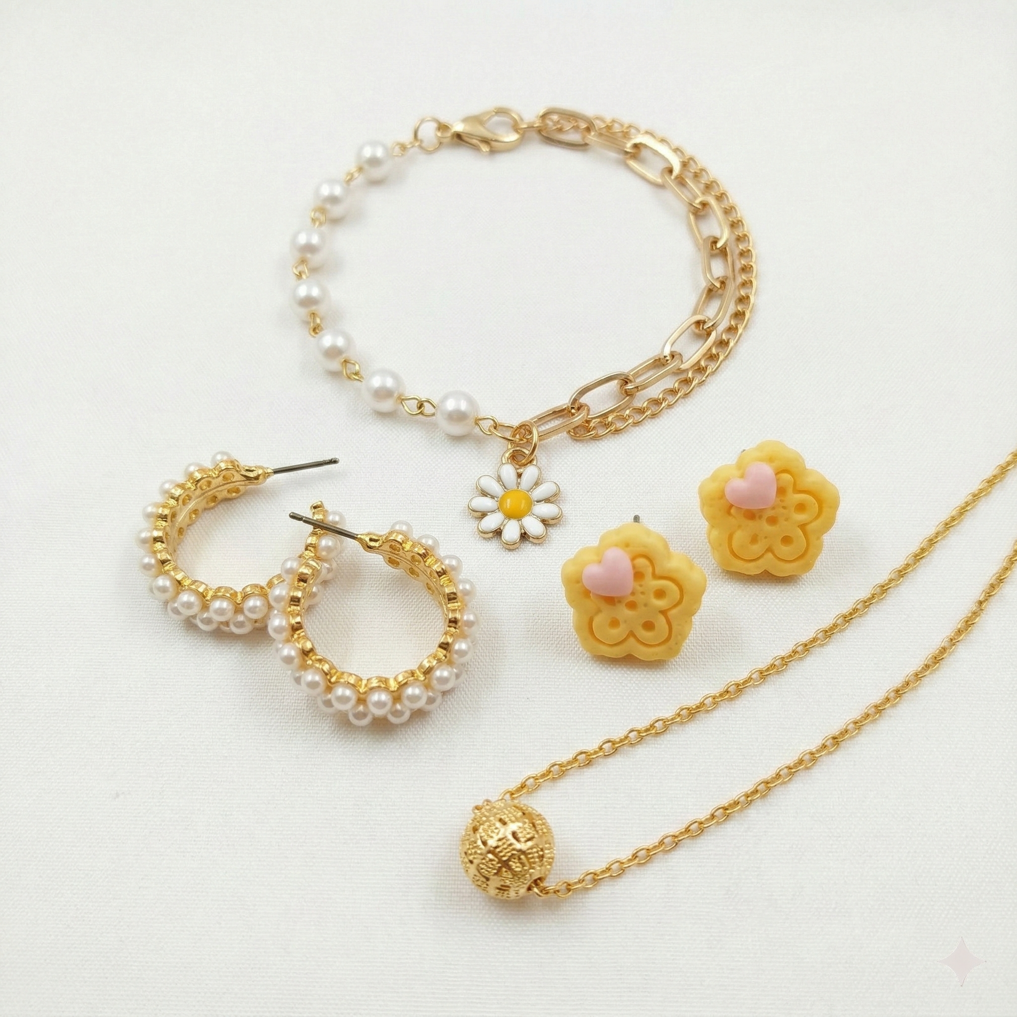 Jewelry set with gold chain, pearl bracelet, hoop earrings, flower-shaped earrings, and necklace on a white background.