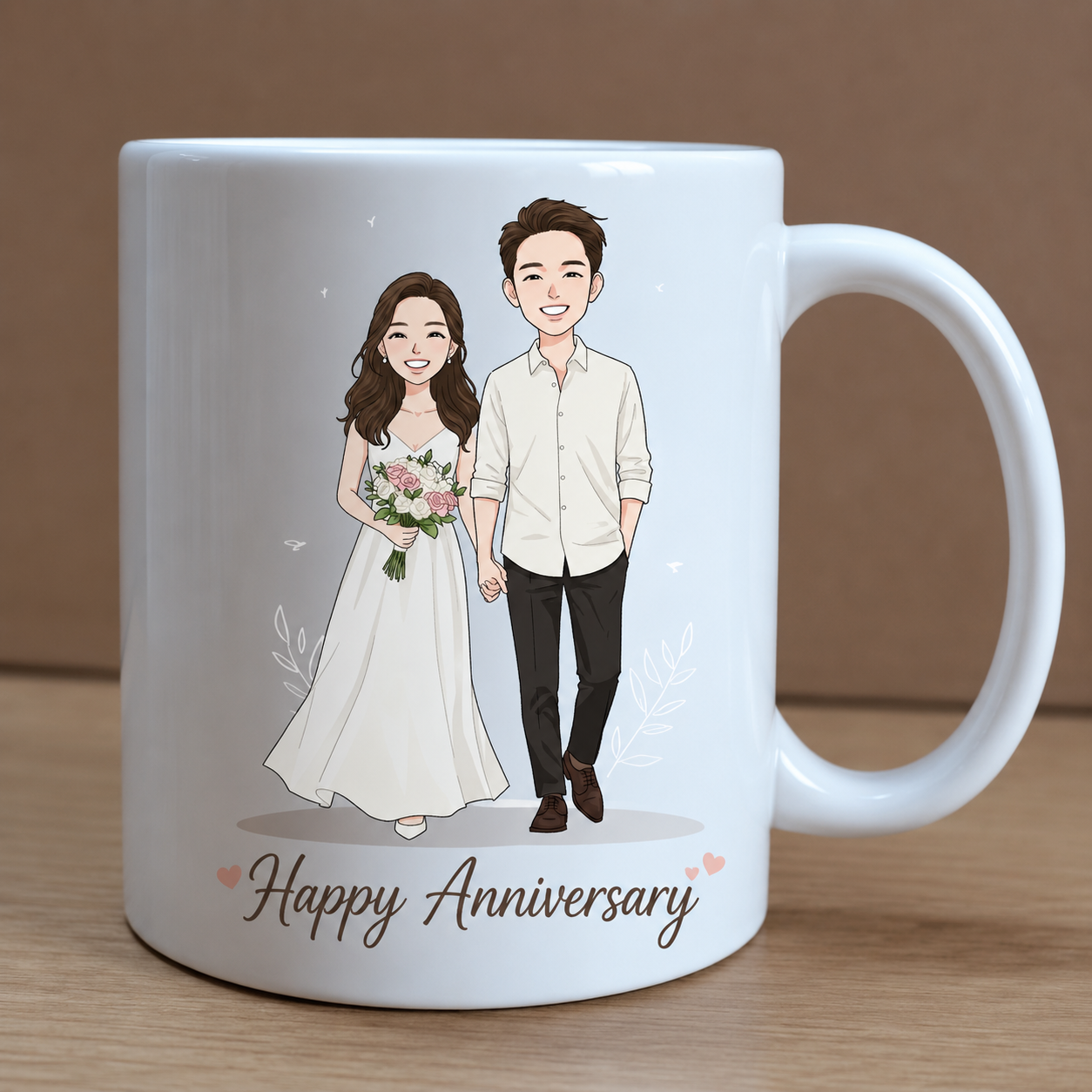 White mug with a cartoon illustration of a couple holding hands and the text 'Happy Anniversary' on a wooden surface.