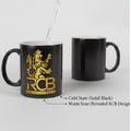 Black mug with gold RCB logo, showing change from cold to warm state.