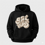 Black hoodie with beige graphic design on a light gray background