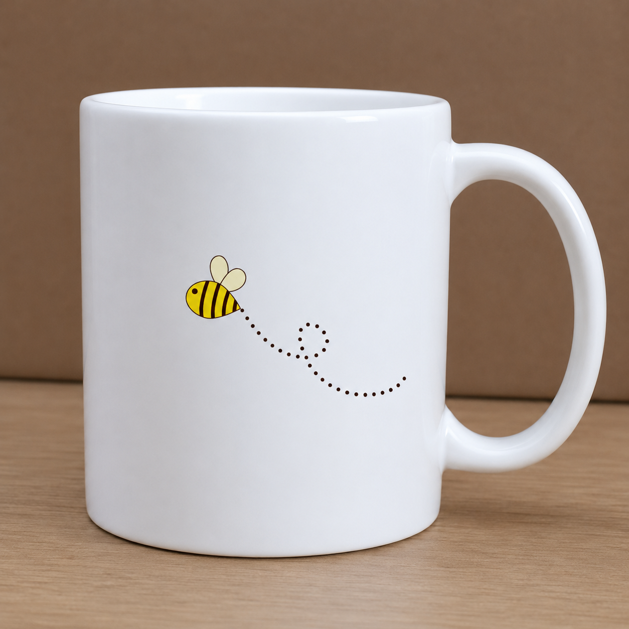 White mug with a bee design on a wooden surface and brown background