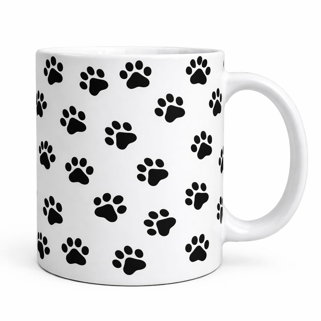 White mug with black paw print pattern on a white background