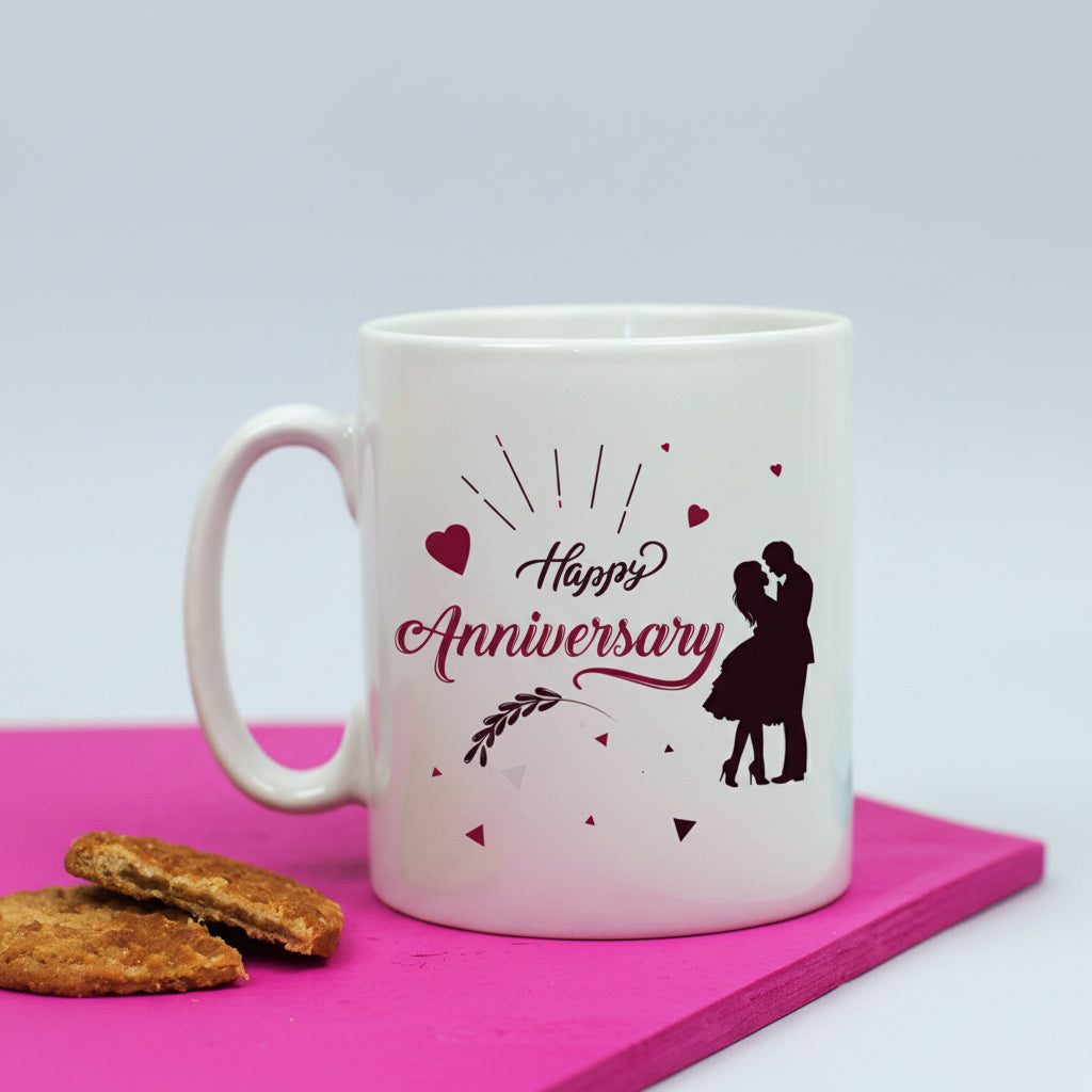 White mug with 'Happy Anniversary' design on a pink surface