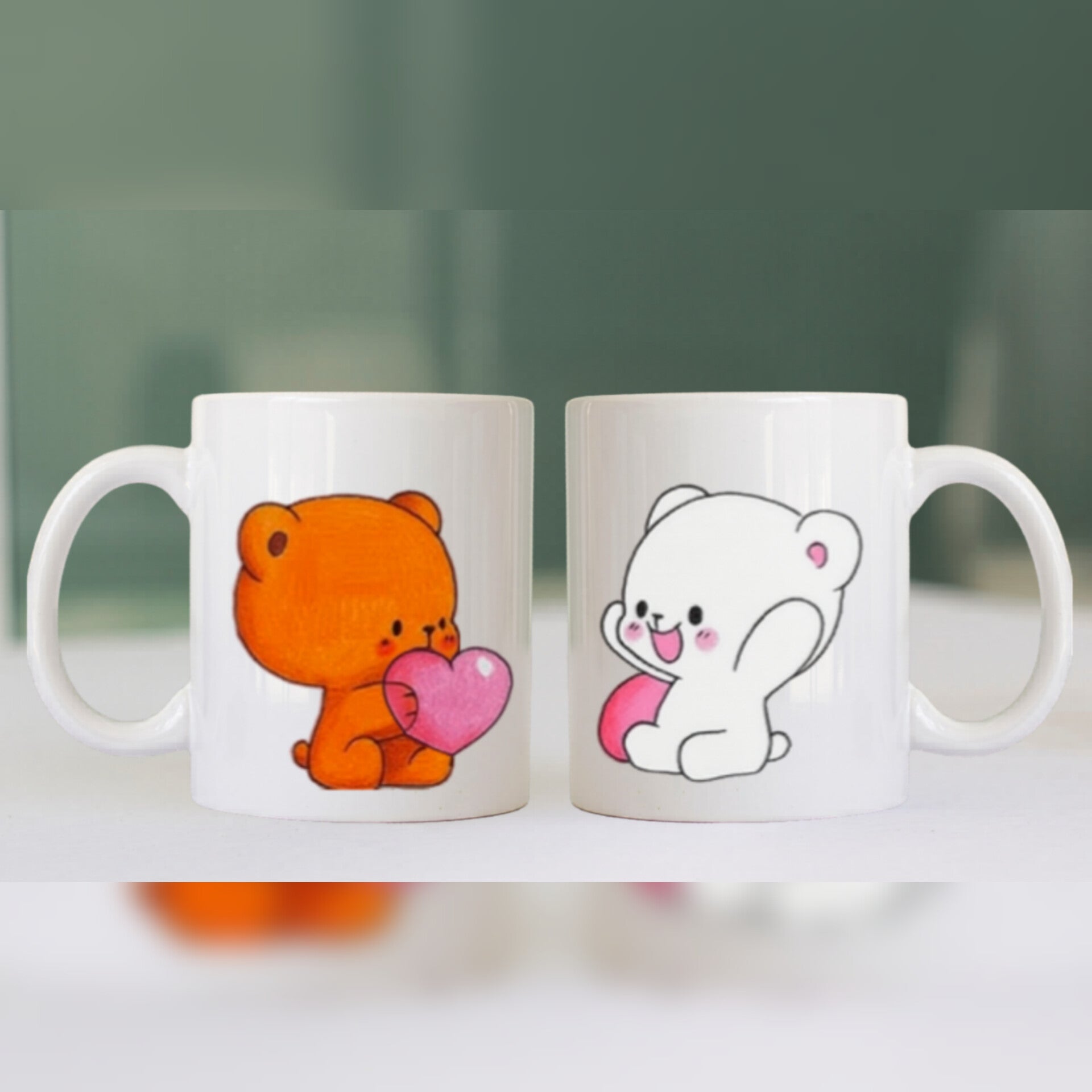 Two mugs with cartoon bear designs on a blurred background