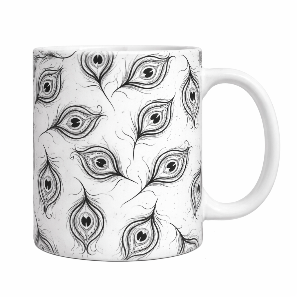 White mug with black peacock feather pattern on a white background