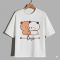 White t-shirt with cartoon bear and panda design on a hanger against a gray background