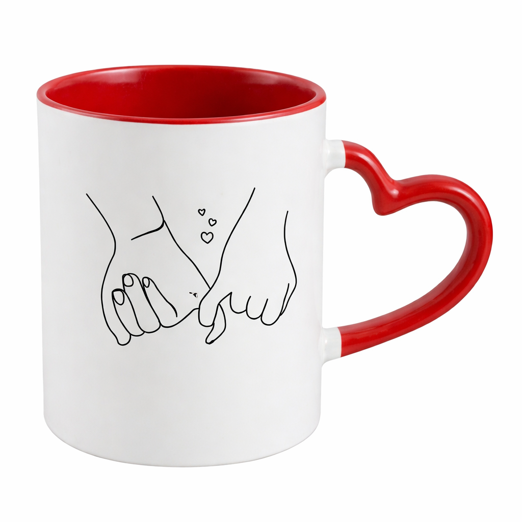 White mug with red interior and handle, featuring a design of two hands holding a heart.