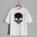 White t-shirt with a black skull design on a gray background