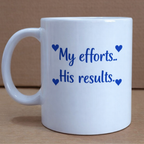 White mug with blue text 'My efforts.. His results.' on a brown background